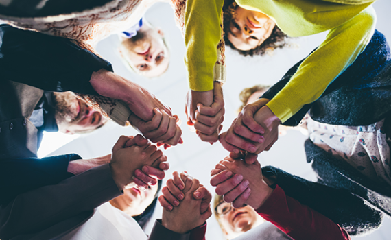 group meeting holding hands